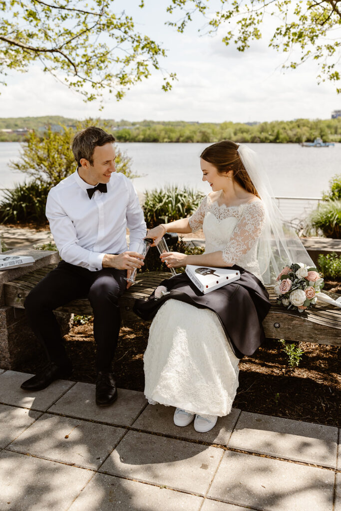 elopement couple on their way to enjoy a wiseguy pizza picnic