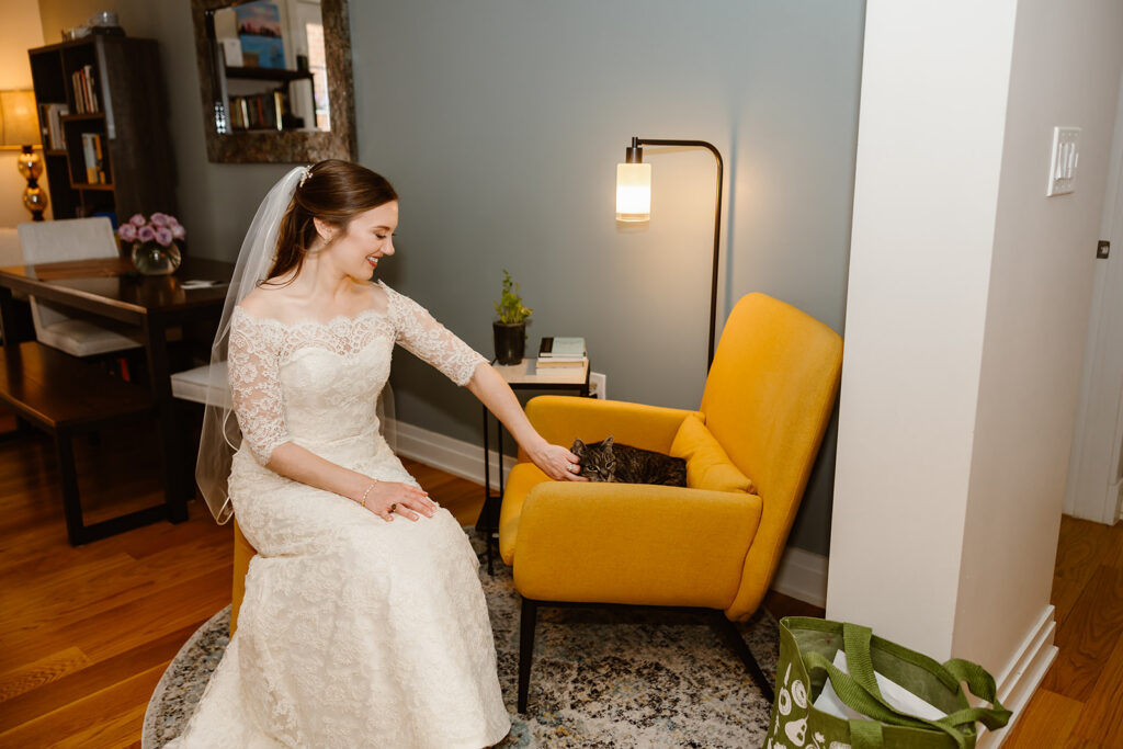 bride snuggling her cat during getting ready