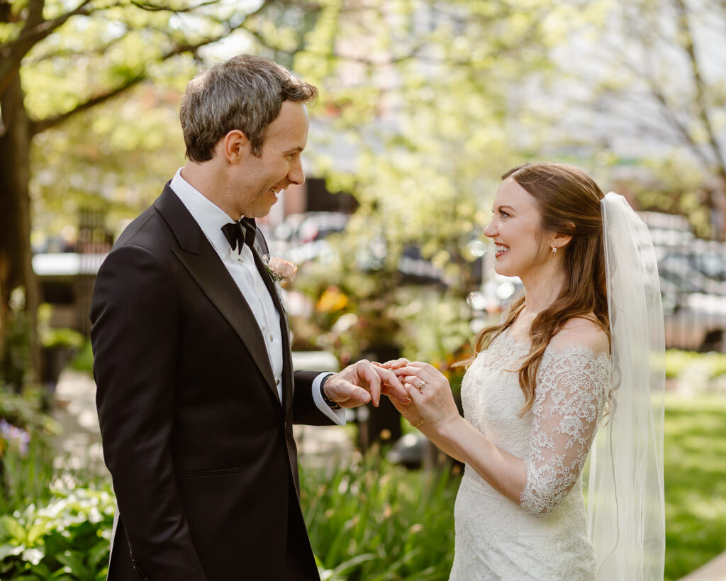 bride and groom exchanging rings